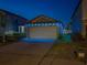 Charming single-story home featuring an attached two-car garage and a cozy lawn at 10222 Cool Waterlily Ave, Riverview, FL 33578