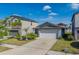 Charming single-Gathering home with a well-maintained lawn, landscaping, and two-car garage at 10222 Cool Waterlily Ave, Riverview, FL 33578