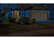 Exterior view of well maintained home at night with decorative holiday lighting at 10222 Cool Waterlily Ave, Riverview, FL 33578