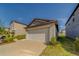 Attached two-car garage offering convenient parking and storage space at 10222 Cool Waterlily Ave, Riverview, FL 33578