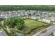 Aerial view of a large green space inside a neighborhood with residences at 10222 Cool Waterlily Ave, Riverview, FL 33578