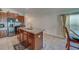 Open kitchen island with stainless steel sink and brown cabinets at 10222 Cool Waterlily Ave, Riverview, FL 33578