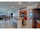 Bright, open kitchen featuring granite countertops, stainless steel appliances, and ceramic tile flooring at 10222 Cool Waterlily Ave, Riverview, FL 33578