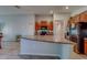 Bright, open kitchen featuring granite countertops, stainless steel appliances, and ceramic tile flooring at 10222 Cool Waterlily Ave, Riverview, FL 33578