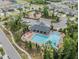 Community pool and playground area with tables, chairs, and lounge seating at 10222 Cool Waterlily Ave, Riverview, FL 33578
