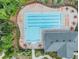 Aerial view of a community pool with lounge seating and clubhouse at 10222 Cool Waterlily Ave, Riverview, FL 33578