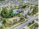 Aerial shot of community pool, clubhouse, basketball court, and adjacent residences at 10222 Cool Waterlily Ave, Riverview, FL 33578