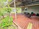 Wide outdoor deck space featuring a table and chairs at 103 1St St, Belleair Beach, FL 33786