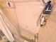 Bathroom featuring a tub with shower and shelving at 103 1St St, Belleair Beach, FL 33786