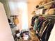 Walk-in closet featuring shelving, storage, and hanging storage at 103 1St St, Belleair Beach, FL 33786