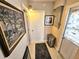 Bright hallway with tile flooring and decor at 103 1St St, Belleair Beach, FL 33786