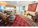 Comfortable living area showcasing eclectic art, ample seating, and natural light with vintage accents at 103 1St St, Belleair Beach, FL 33786