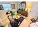Bright home office with a hardwood desk and cabinet storage space at 103 1St St, Belleair Beach, FL 33786