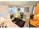 Bright home office with window views and carpeted floor at 103 1St St, Belleair Beach, FL 33786