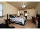 Bedroom with carpeted floors, a ceiling fan, and a view of the backyard at 10400 Golden Ave, Weeki Wachee, FL 34613