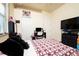 Bedroom with carpet, closets, a desk and a mounted TV at 10400 Golden Ave, Weeki Wachee, FL 34613