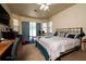 Bedroom with large windows, carpeted floors, and access to backyard at 10400 Golden Ave, Weeki Wachee, FL 34613