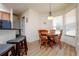 Cozy dining area with hardwood floors, and a window offering natural light at 10400 Golden Ave, Weeki Wachee, FL 34613