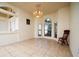 Dining room features a chandelier and a view of the front yard at 10400 Golden Ave, Weeki Wachee, FL 34613