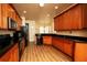 Kitchen features granite countertops, wood cabinets, and stainless steel appliances at 10400 Golden Ave, Weeki Wachee, FL 34613