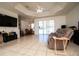 Open-concept living room with tile floors and dining area at 10400 Golden Ave, Weeki Wachee, FL 34613