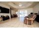 Open-concept living room with tile floors and dining area at 10400 Golden Ave, Weeki Wachee, FL 34613