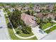 Aerial view of a well maintained house and its manicured lot with the surrounding neighborhood at 10608 Gretna Green Dr, Tampa, FL 33626