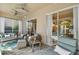Comfortable covered lanai features cozy seating and views of the sparkling pool area at 10608 Gretna Green Dr, Tampa, FL 33626