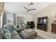 Inviting living room with a large sectional, stylish decor, and entertainment center for relaxation and enjoyment at 10608 Gretna Green Dr, Tampa, FL 33626
