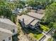 Beautiful aerial view showcasing the home's well-maintained lawn, landscaping, and charming curb appeal at 1115 Crescent Lake N Dr, St Petersburg, FL 33701