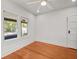 Bright bedroom with hardwood floors, large windows, and neutral paint at 1115 Crescent Lake N Dr, St Petersburg, FL 33701