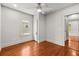 Bright bedroom with hardwood floors, a ceiling fan, and natural light at 1115 Crescent Lake N Dr, St Petersburg, FL 33701