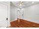 Cozy bedroom with hardwood floors and a bright ceiling fan with great natural light at 1115 Crescent Lake N Dr, St Petersburg, FL 33701