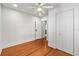 Cozy bedroom with wood floors, closet, and ceiling fan at 1115 Crescent Lake N Dr, St Petersburg, FL 33701