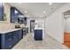 Beautiful kitchen with stainless steel appliances, stylish blue cabinets and a center island at 1115 Crescent Lake N Dr, St Petersburg, FL 33701