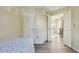 Comfortable bedroom includes closet and doorway to living area at 115 112Th Ne Ave # 1027, St Petersburg, FL 33716