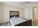 Bedroom featuring wood floors, ceiling fan, and a comfortable bed at 115 112Th Ne Ave # 1027, St Petersburg, FL 33716
