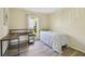Cozy bedroom with a desk, natural light and wood flooring at 115 112Th Ne Ave # 1027, St Petersburg, FL 33716