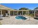 Intimate hot tub area with pergola, perfect for relaxing in privacy amidst lush landscaping at 115 112Th Ne Ave # 1027, St Petersburg, FL 33716