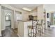 Well-equipped kitchen with stainless steel appliances, a breakfast bar, and access to the living area at 115 112Th Ne Ave # 1027, St Petersburg, FL 33716