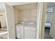 Laundry closet with a washer and dryer at 115 112Th Ne Ave # 1027, St Petersburg, FL 33716
