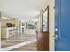 Bright and airy living room featuring wood floors, a fireplace, and an open floor plan at 115 112Th Ne Ave # 1027, St Petersburg, FL 33716