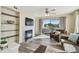 Cozy living room with a fireplace, built-in shelves, and access to a private balcony at 115 112Th Ne Ave # 1027, St Petersburg, FL 33716