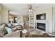 Bright living room features a fireplace, built-in shelves, and breakfast bar at 115 112Th Ne Ave # 1027, St Petersburg, FL 33716