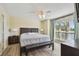 Serene main bedroom featuring waterfront view and wood flooring at 115 112Th Ne Ave # 1027, St Petersburg, FL 33716