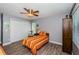 Neutral bedroom featuring a ceiling fan, closet, and luxury vinyl plank flooring at 11510 Moffat Pl, Temple Terrace, FL 33617