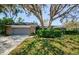 Charming brick home with a well-manicured lawn and mature trees in a peaceful setting at 11510 Moffat Pl, Temple Terrace, FL 33617