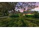 Beautiful exterior view of a brick home enhanced by a colorful sunset at 11510 Moffat Pl, Temple Terrace, FL 33617