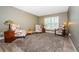 Comfortable living room featuring plush carpeting and stylish decor creating a warm atmosphere at 11510 Moffat Pl, Temple Terrace, FL 33617