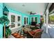 Outdoor patio with comfortable seating and a ceiling fan, perfect for relaxation at 11510 Moffat Pl, Temple Terrace, FL 33617
